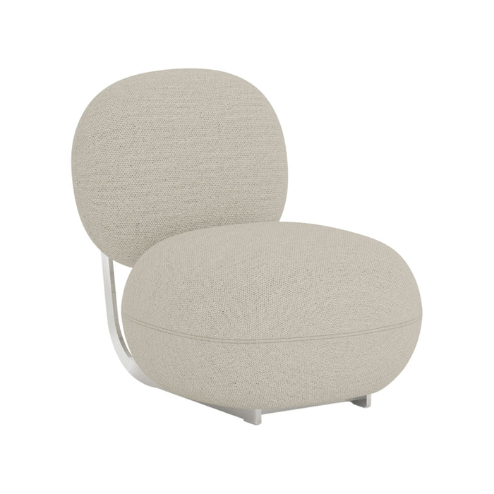 Light beige textured lounge chair with a smooth, rounded design and silver metallic base. Ideal for modern decor.