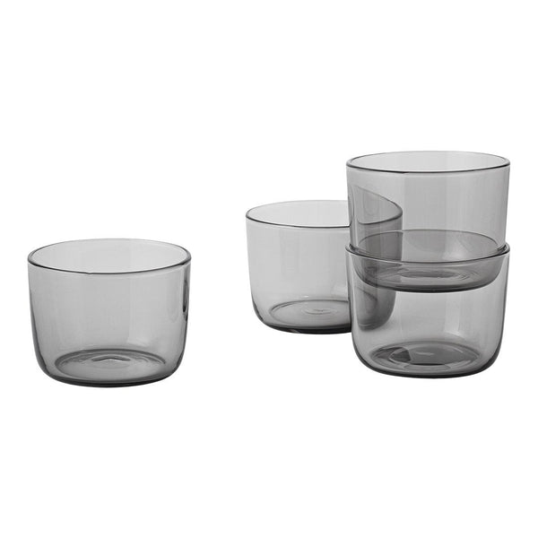 Set of four sleek, smoky gray glass cups with a modern, minimalist design. Perfect for elegant dining.