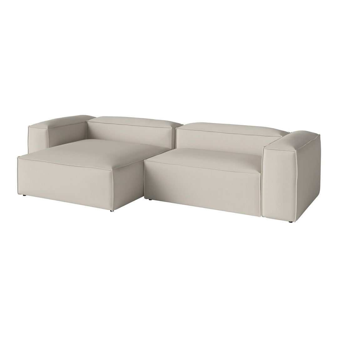 Light beige sectional sofa with smooth, minimalist design and no visible patterns.