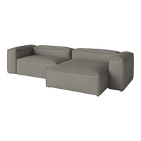 Gray modular sofa with a minimalist design, featuring solid colors and clean lines for a modern aesthetic.