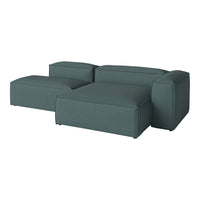 Teal fabric sectional sofa with modern, minimalist design and subtle textured pattern. Perfect for contemporary interiors.