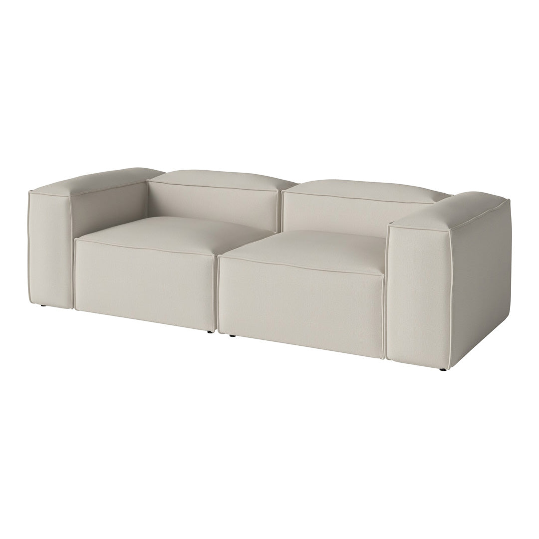 Light beige modern sectional sofa with smooth upholstery and minimalist design, perfect for contemporary spaces.