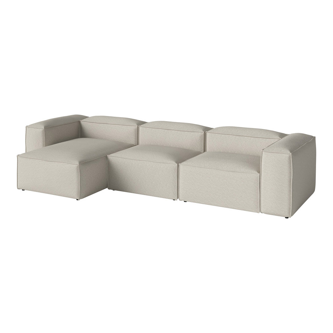 Light gray modular sofa with smooth, minimalist design and soft, textured upholstery for modern interiors.