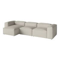 Light gray modular sofa with smooth, minimalist design and soft, textured upholstery for modern interiors.