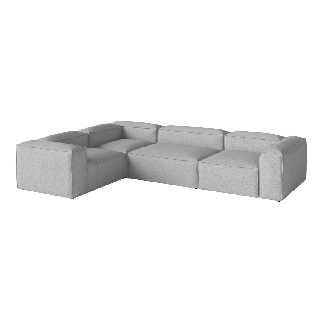 Gray modular sectional sofa with smooth, modern lines and a minimalist, solid fabric design. Perfect for contemporary spaces.