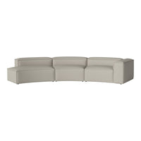 Light beige curved sectional sofa with a smooth, textured fabric for modern elegance.