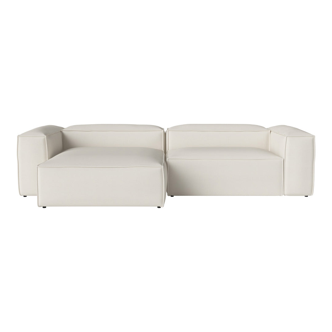 Modern L-shaped sofa in neutral white upholstery with clean lines and minimalistic design.