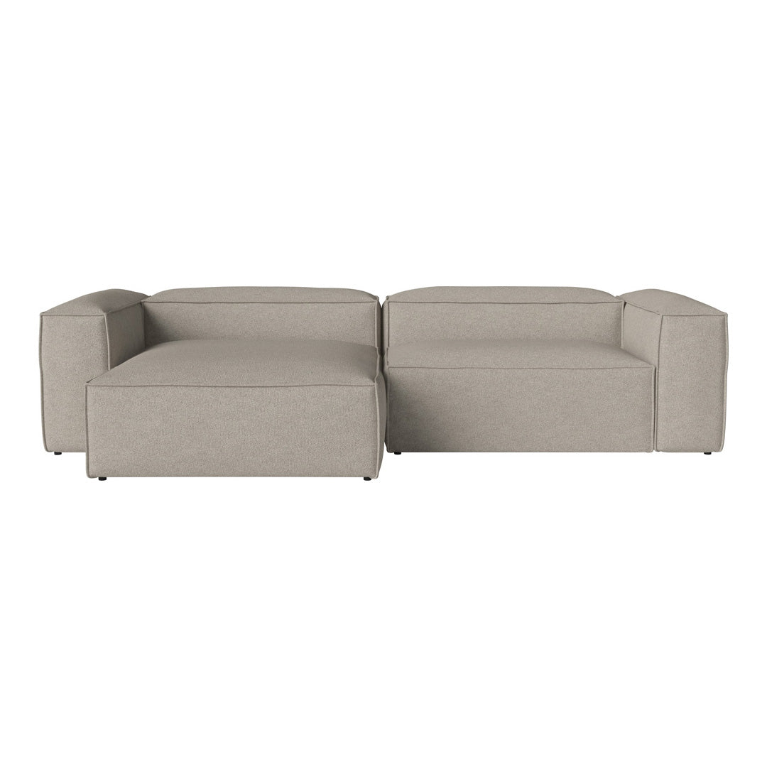 Light gray sectional sofa with a minimalist design and soft, textured fabric, perfect for modern interiors.