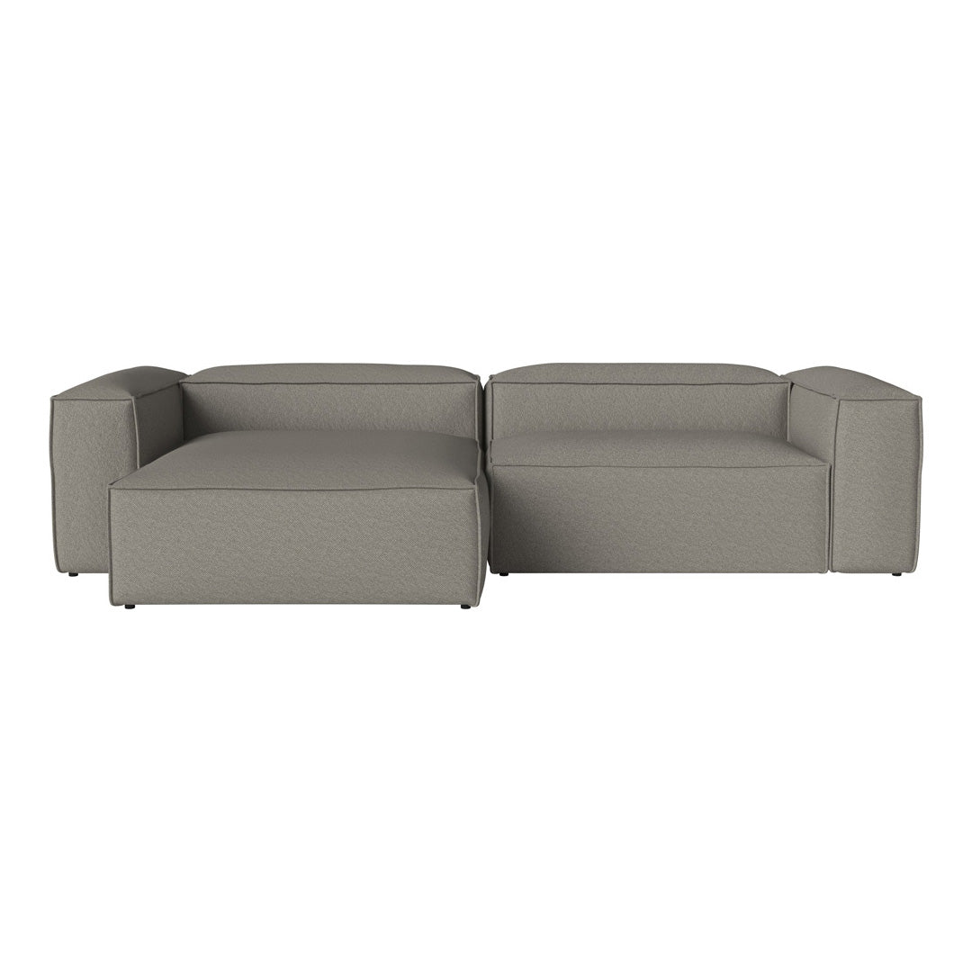 Gray modular sofa with a sleek, modern design and smooth textures, ideal for contemporary living spaces.