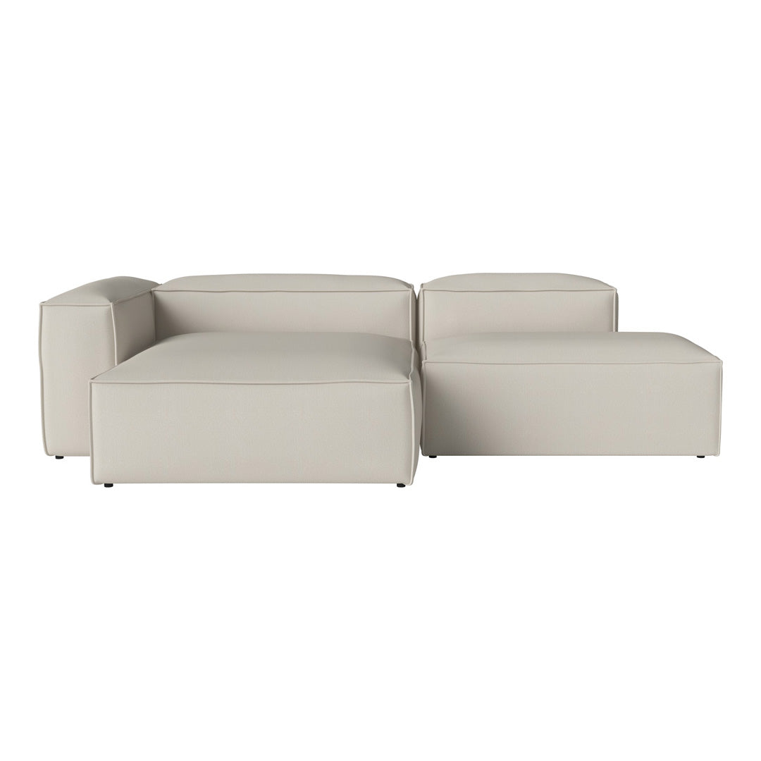 Light beige sectional sofa with a modern, minimalist design, featuring smooth, clean lines and no patterns.