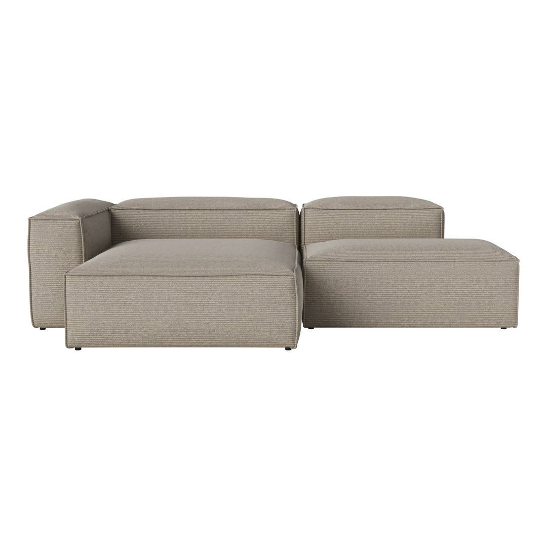 Beige modular sofa with a smooth, textured fabric and clean, modern lines, perfect for contemporary decor.