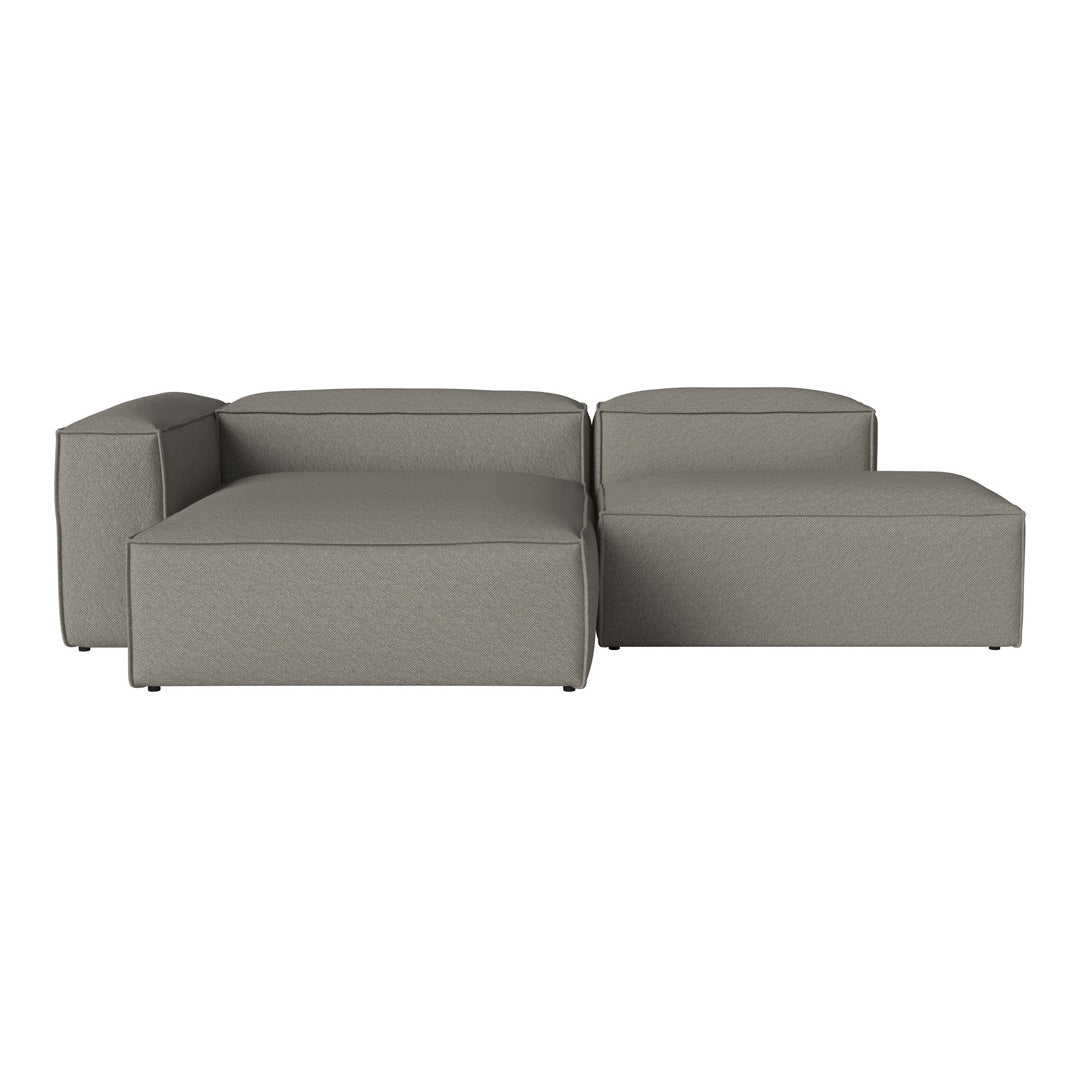 Gray modular sofa with a smooth, sleek fabric and contemporary design. Perfect for modern living spaces.