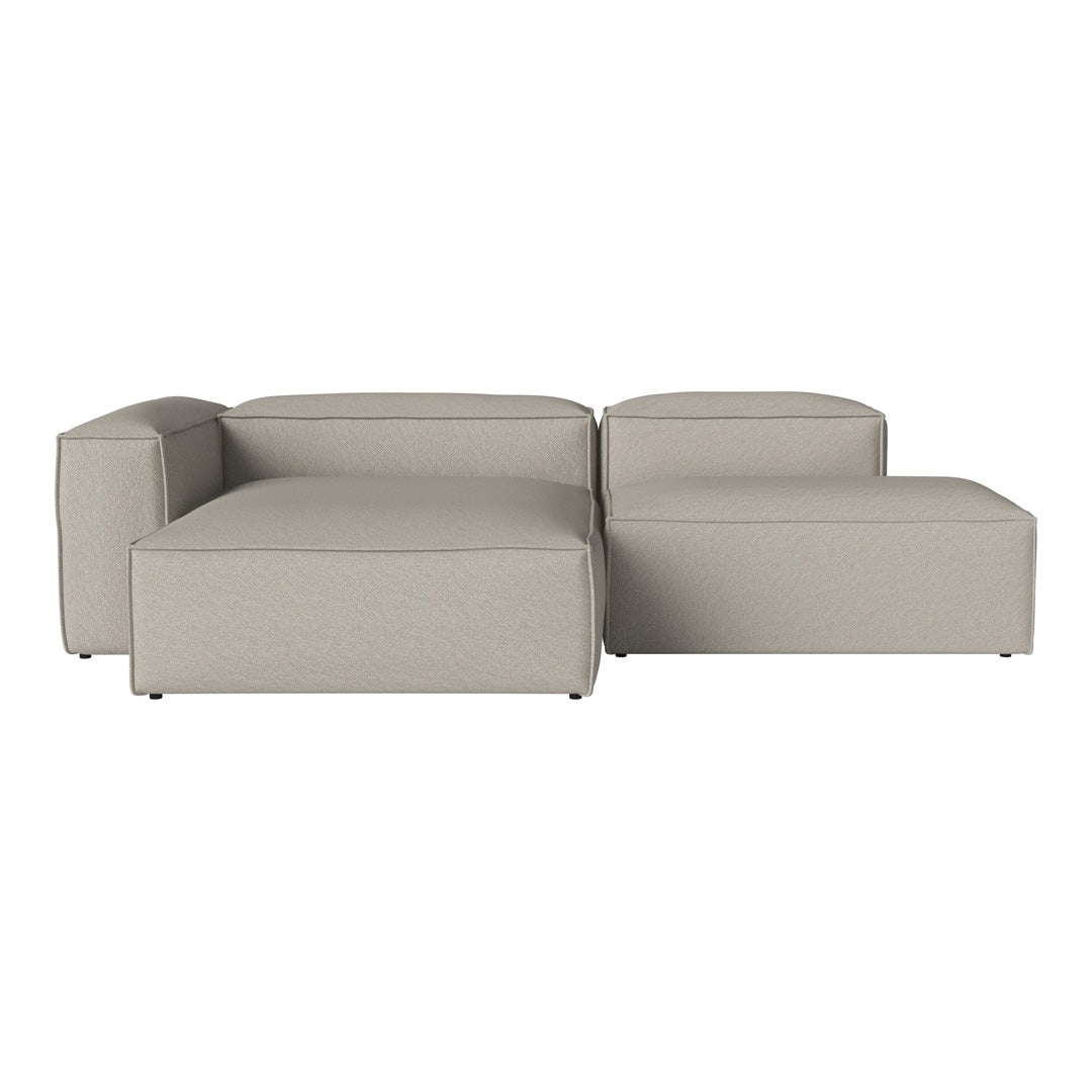 Light gray sectional sofa with a modern, minimalist design and subtle textured fabric. Perfect for contemporary living spaces.