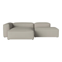 Light gray sectional sofa with a modern, minimalist design and subtle textured fabric. Perfect for contemporary living spaces.