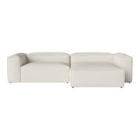 Modern white sectional sofa with smooth leather upholstery and structured geometric design. Perfect for contemporary decor.