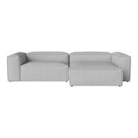 Gray modular sofa with a simple, modern design and clean lines, featuring a textured fabric finish.