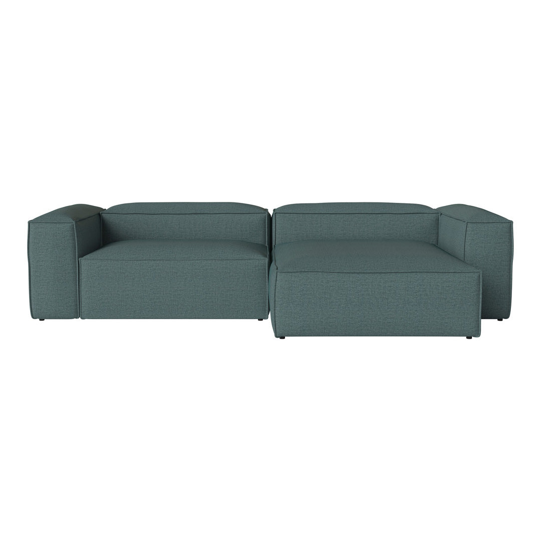 Teal modular sofa with a smooth fabric texture and minimalist design, perfect for modern living spaces.