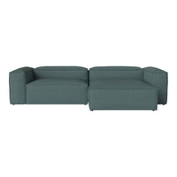 Teal modular sofa with a smooth fabric texture and minimalist design, perfect for modern living spaces.