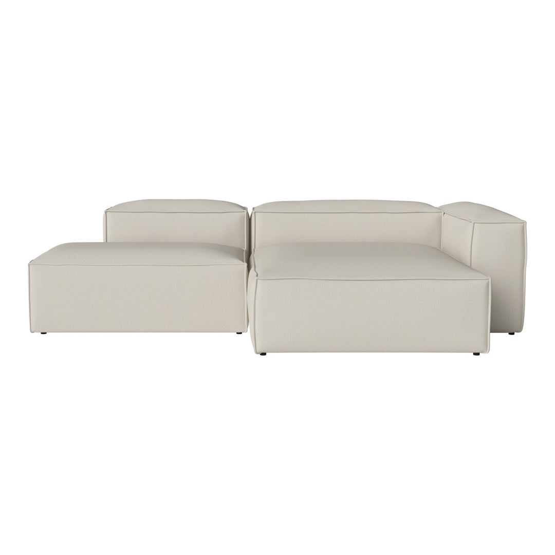 Minimalist cream sectional sofa with smooth, sleek surfaces and rounded edges, perfect for modern interiors.