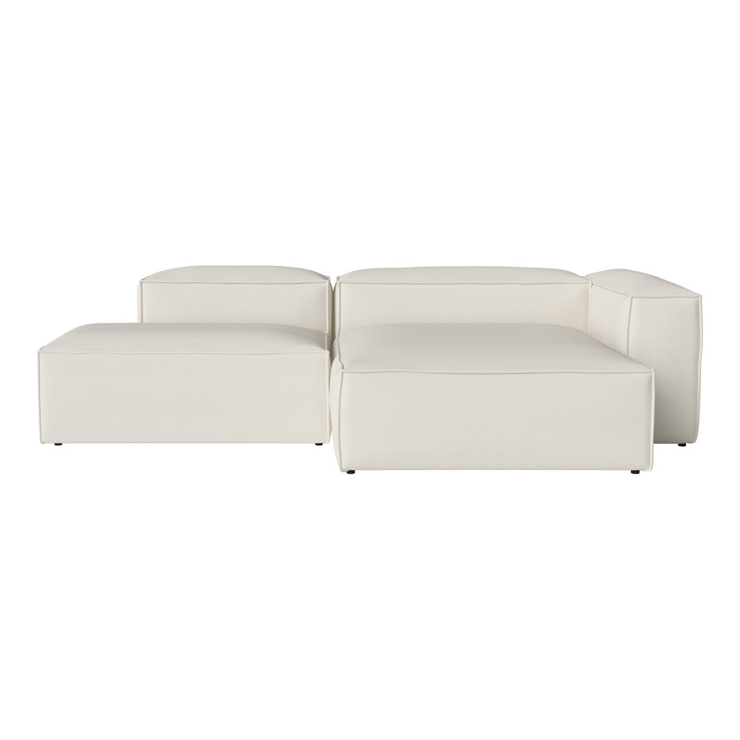 White modular sofa in a minimalist design with smooth, contemporary lines and a sleek, textured finish.
