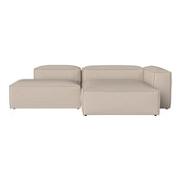 Beige modular sofa with a smooth, contemporary design, featuring minimalist lines and solid color pattern.