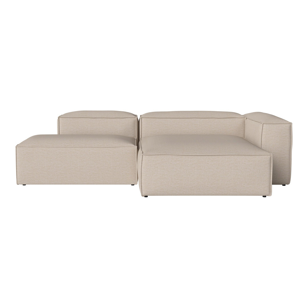 Beige modular sofa with a smooth, contemporary design, featuring minimalist lines and solid color pattern.