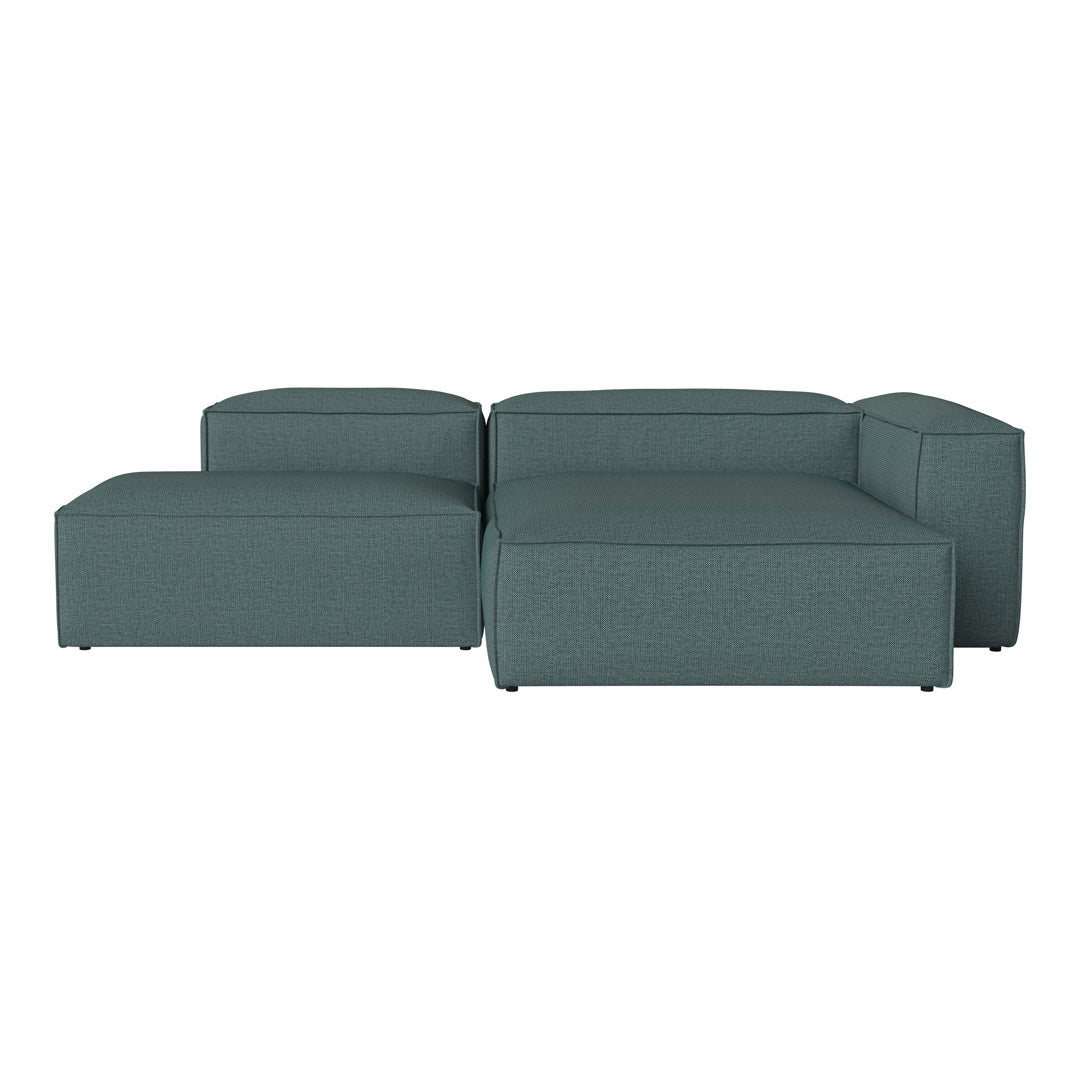 Teal sectional sofa with a textured pattern, featuring clean lines and a modern design ideal for contemporary spaces.