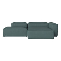 Teal sectional sofa with a textured pattern, featuring clean lines and a modern design ideal for contemporary spaces.