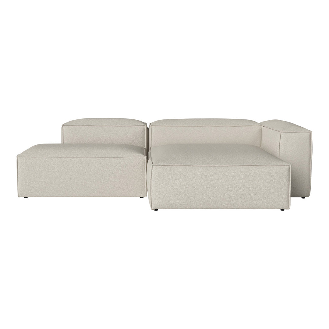 Soft beige modular sofa with smooth texture and minimalist design, perfect for modern living spaces.