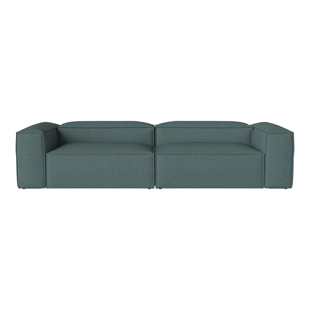 Teal upholstery sectional sofa with a minimalist design and textured surface for modern living spaces.