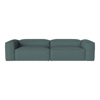 Teal upholstery sectional sofa with a minimalist design and textured surface for modern living spaces.