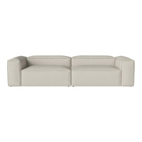 Modern, minimalist sofa in soft beige with a sleek, streamlined design and smooth upholstery.