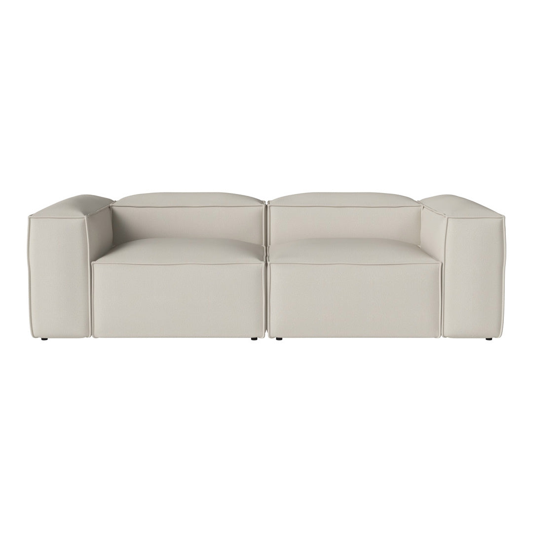 Beige modern sofa with smooth leather texture and minimalist design, perfect for contemporary indoor spaces.