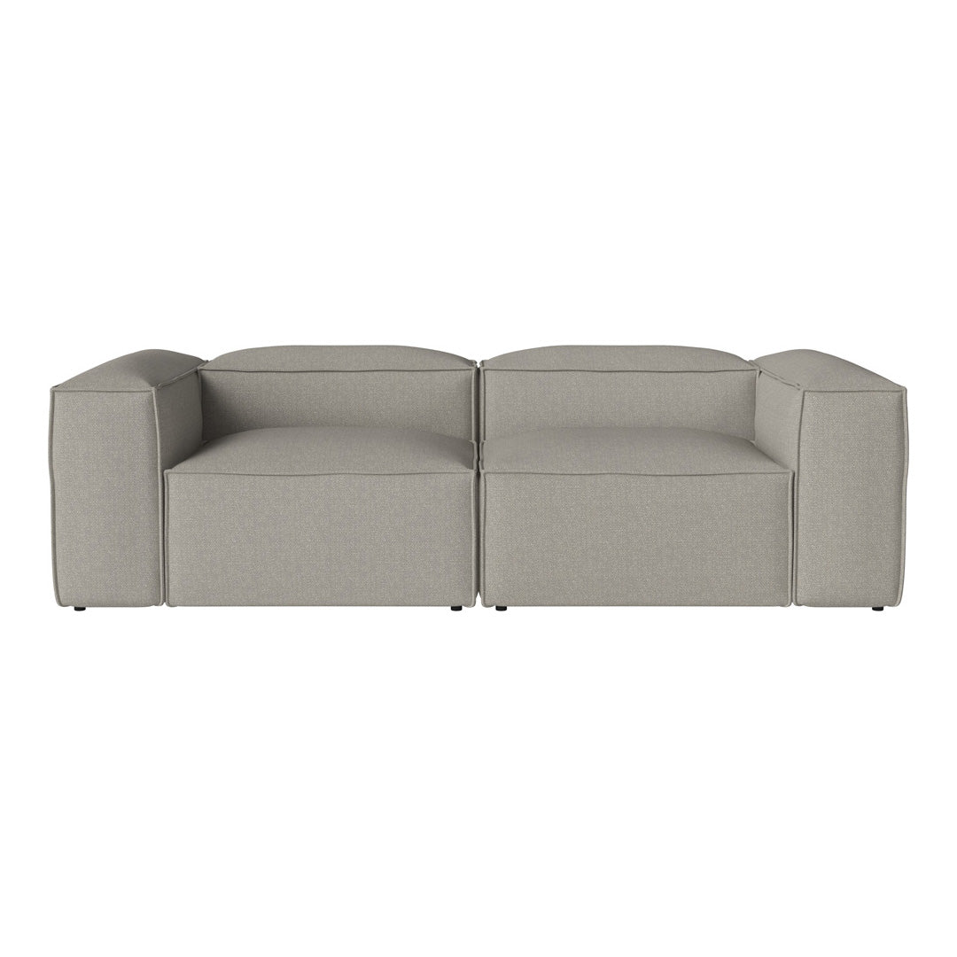 Gray modular sofa with a minimalist design and smooth, textured fabric, ideal for modern interiors.