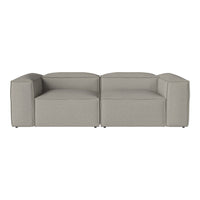 Gray modular sofa with a minimalist design and smooth, textured fabric, ideal for modern interiors.