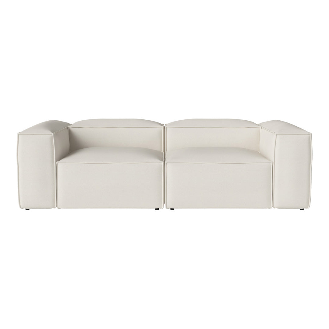 Stylish white modular sofa with a smooth, minimalist design and modern geometric shapes. Ideal for contemporary decor.