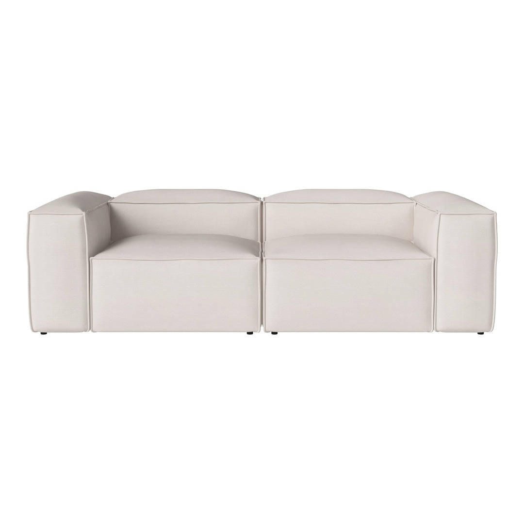 Modern white sectional sofa with smooth, clean lines and a minimalist design. Perfect for contemporary decor.