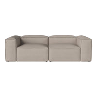Beige modular sofa with a smooth texture and contemporary design, featuring clean lines and a minimalist style.