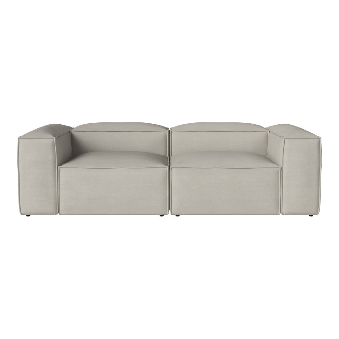 Modern light gray sofa with a sleek, minimalist design and smooth, textured fabric. Perfect for contemporary spaces.