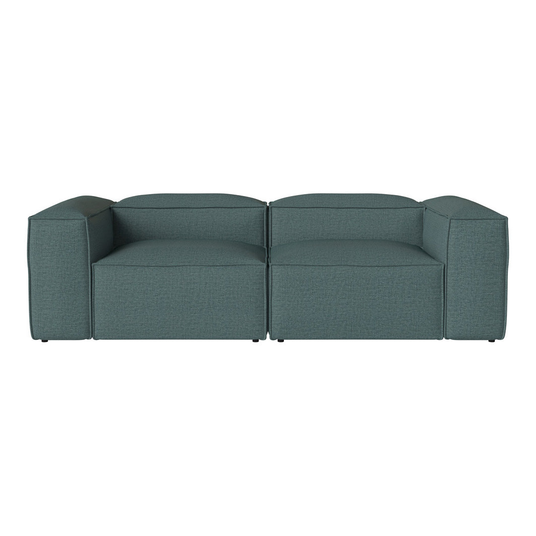 Teal upholstered sofa with a textured pattern and modern block design, perfect for contemporary interiors.