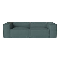Teal upholstered sofa with a textured pattern and modern block design, perfect for contemporary interiors.
