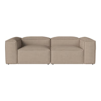 Beige modular sofa with sleek design, featuring a textured fabric and minimalistic, modern aesthetic.