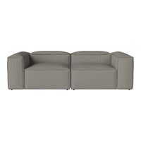 Gray modular sofa with clean lines and a minimalist design, featuring a smooth, textured fabric pattern.
