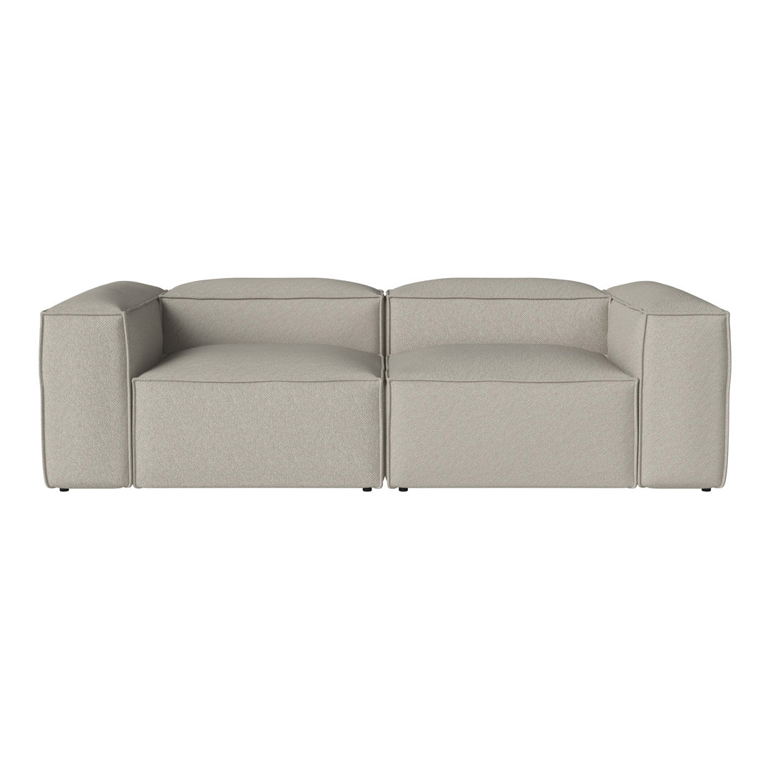 Gray modular sofa with a smooth, contemporary fabric and minimalist design, perfect for modern interiors.