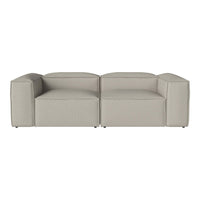 Gray modular sofa with a smooth, contemporary fabric and minimalist design, perfect for modern interiors.