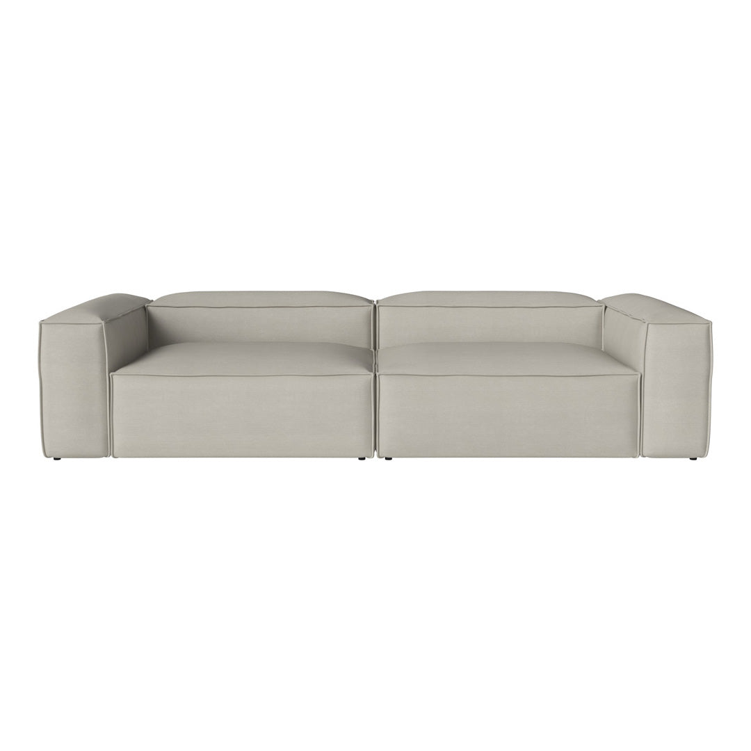Minimalist light gray sectional sofa with a smooth, seamless design, perfect for modern living spaces.