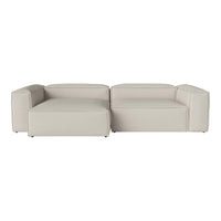 Modern modular sofa in a soft cream color with a sleek, minimal design. No patterns, just smooth textures.