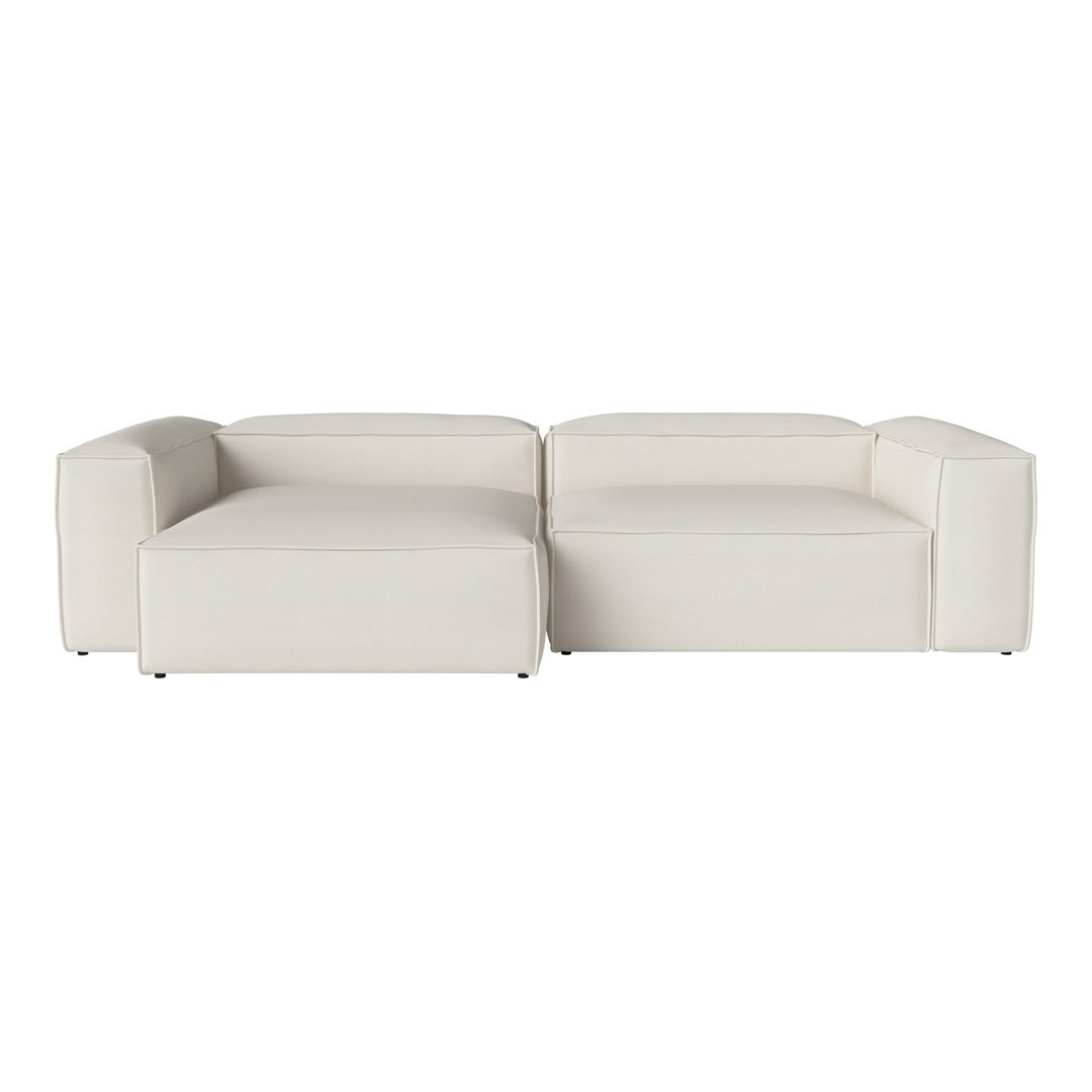 Modern white sectional couch with sleek lines and minimalistic design, perfect for a contemporary living space.