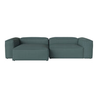 Teal sectional sofa with a modern, minimalist design and textured fabric finish, perfect for contemporary living spaces.