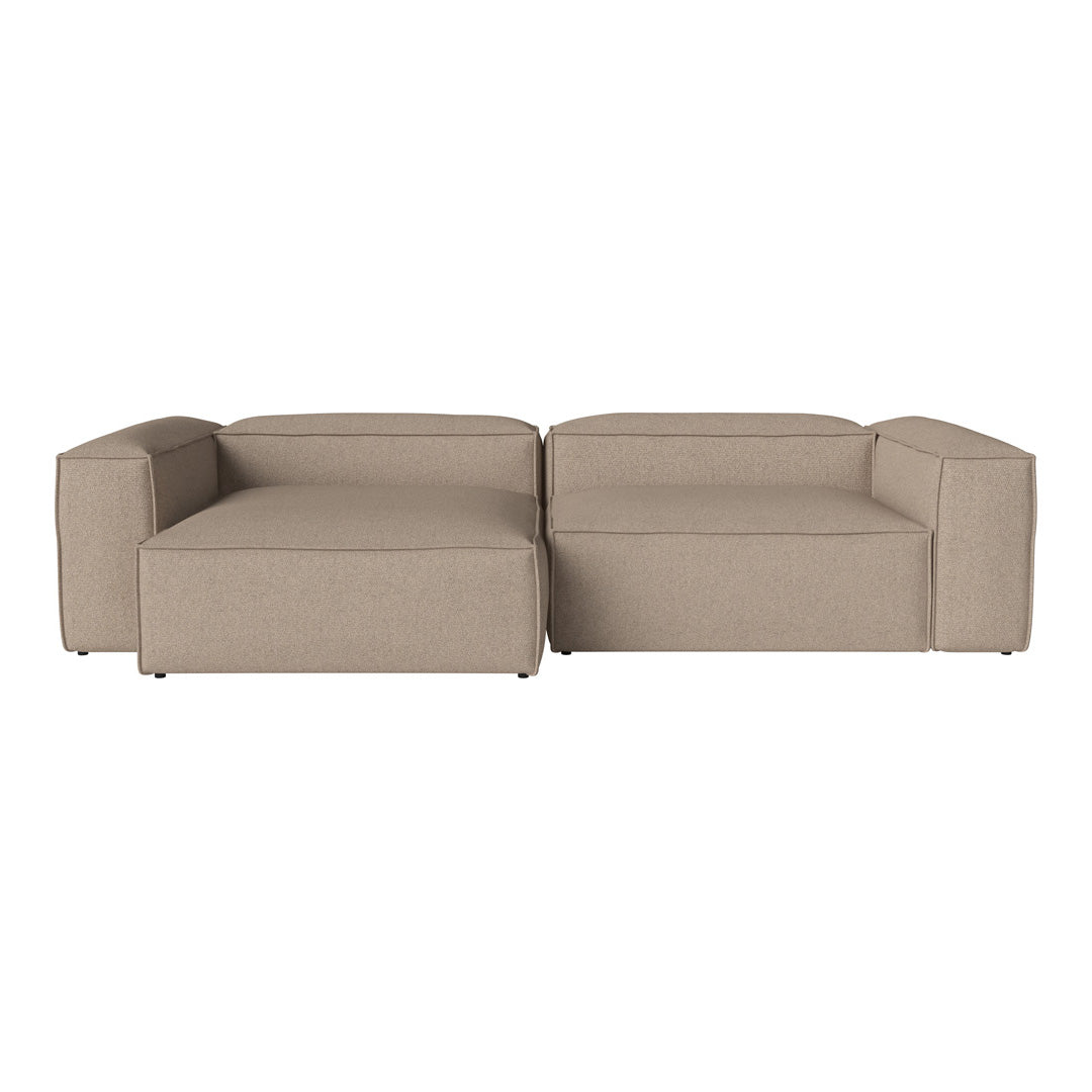 Beige sectional sofa with a minimalist design and smooth, solid fabric texture. Perfect for modern living spaces.